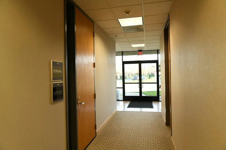 Office hallway with glass exit door